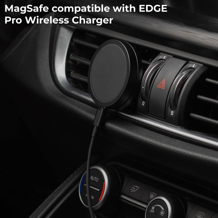 MagSafe Car Mount - MagSafe Car Mount - MagSafe Car Mount - Black MagSafe car mount attached to car air vent with a circular wireless charger pad and cable connected. - Rolling Square MagSafe Car Mount - MagSafe Car Mount - Black MagSafe car mount attached to car air vent with a circular wireless charger pad and cable connected. - Rolling Square