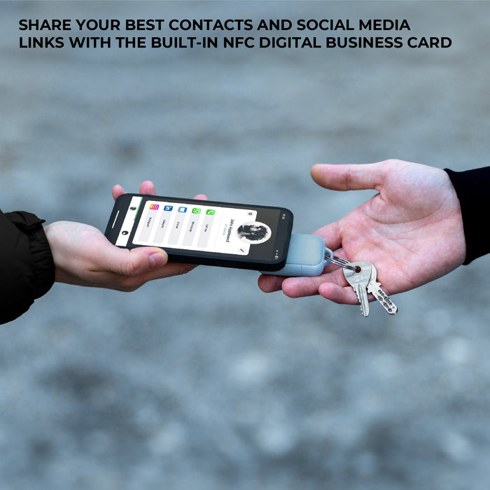 TAU® 2 - Emergency keyring power bank - TAU® 2 - Emergency keyring power bank - Mercury Black - Compact charcoal black keyring power bank attached to keys next to smartphone displaying NFC digital business card interface. - Rolling Square TAU® 2 - Emergency keyring power bank - Mercury Black - Compact charcoal black keyring power bank attached to keys next to smartphone displaying NFC digital business card interface. - Rolling Square